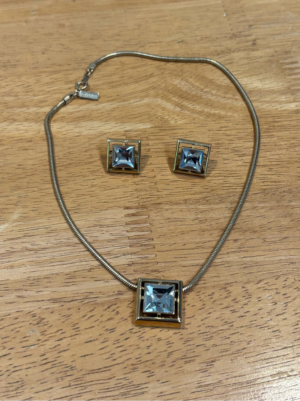 Avon signed 1980s geometric gold tone necklace and clip earrings set